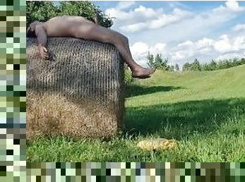 A chub cums outside after playing with a thong on a hay bale