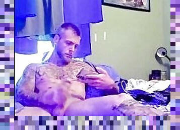 Sexy tattooed guy with big dick masturbates