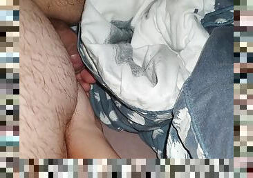 The stepmothers hand goes under the blanket taking out her stepsons cock and gives him a handjob gently