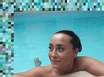 Aroused female filmed by the pool working her magic in true porno