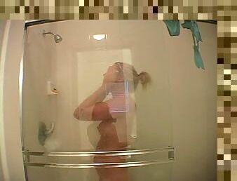 Leg shaving naked blonde in the shower